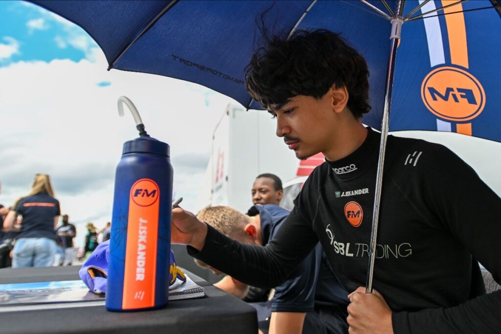 Signing autographs in the Donington paddock