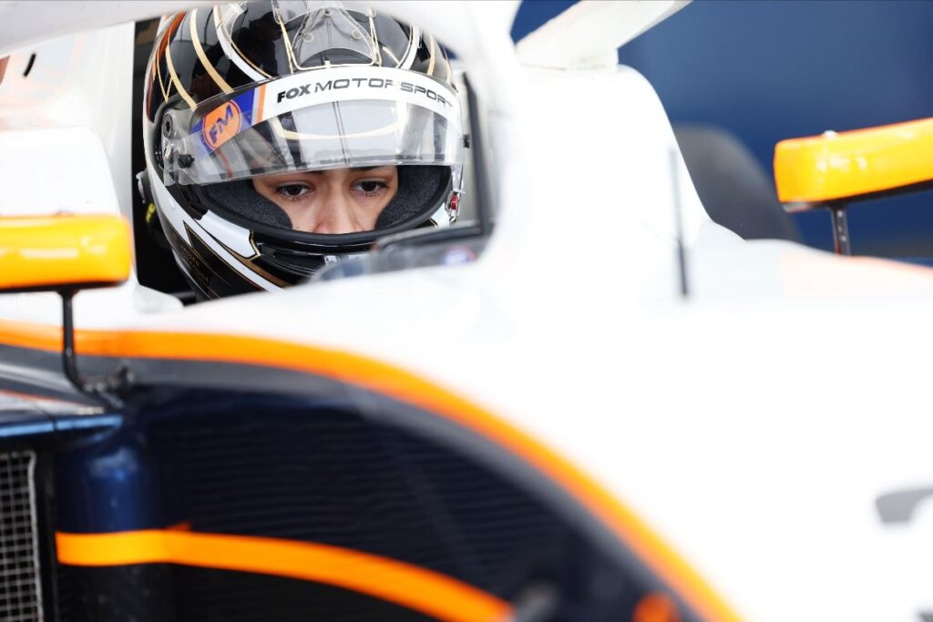 Strapped in for his first car race